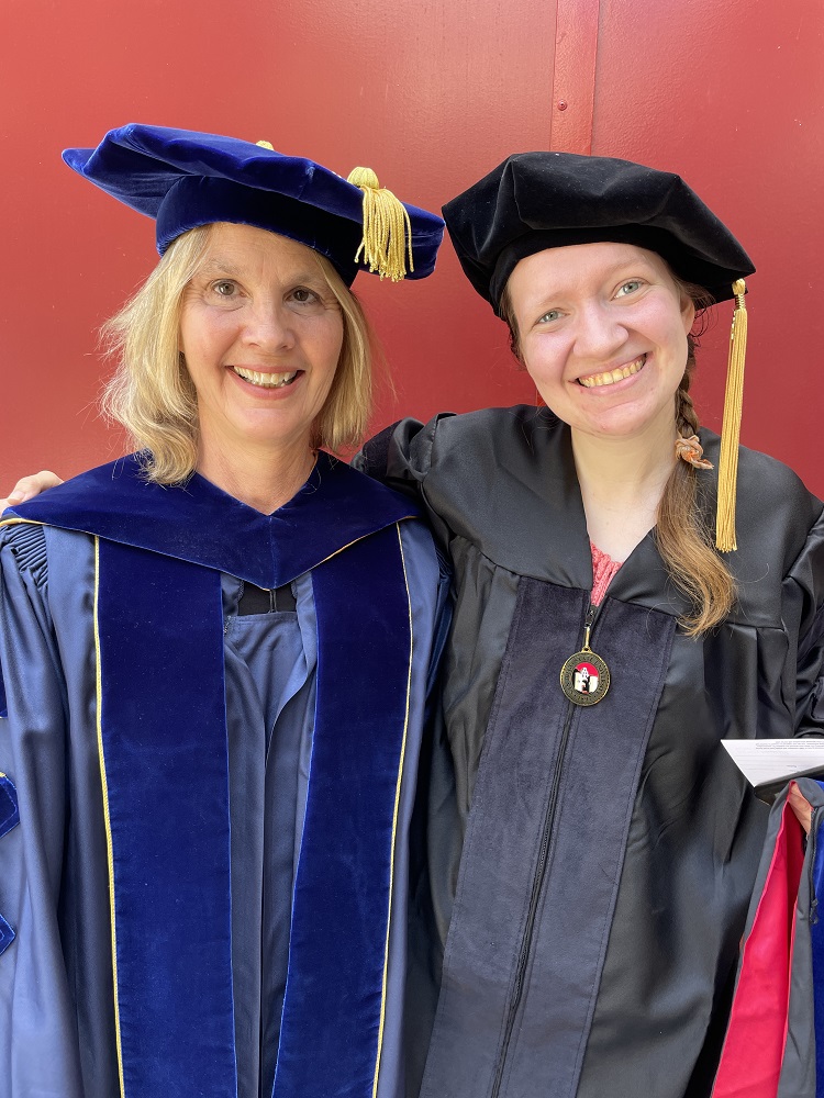 Dr. Meghan McGarry standing with mentor during graduation