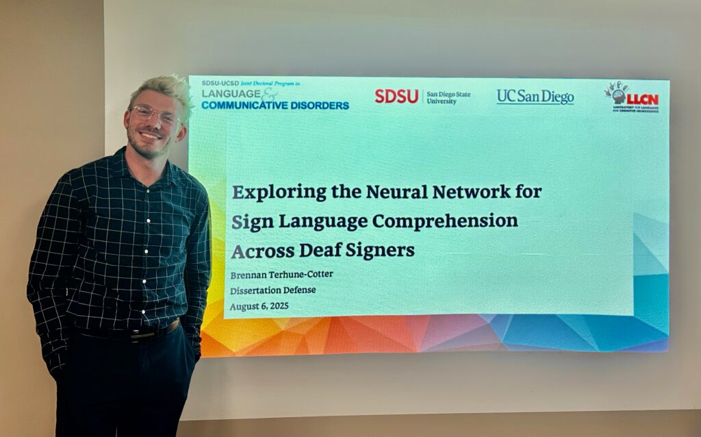 Brennan with their dissertation presentation